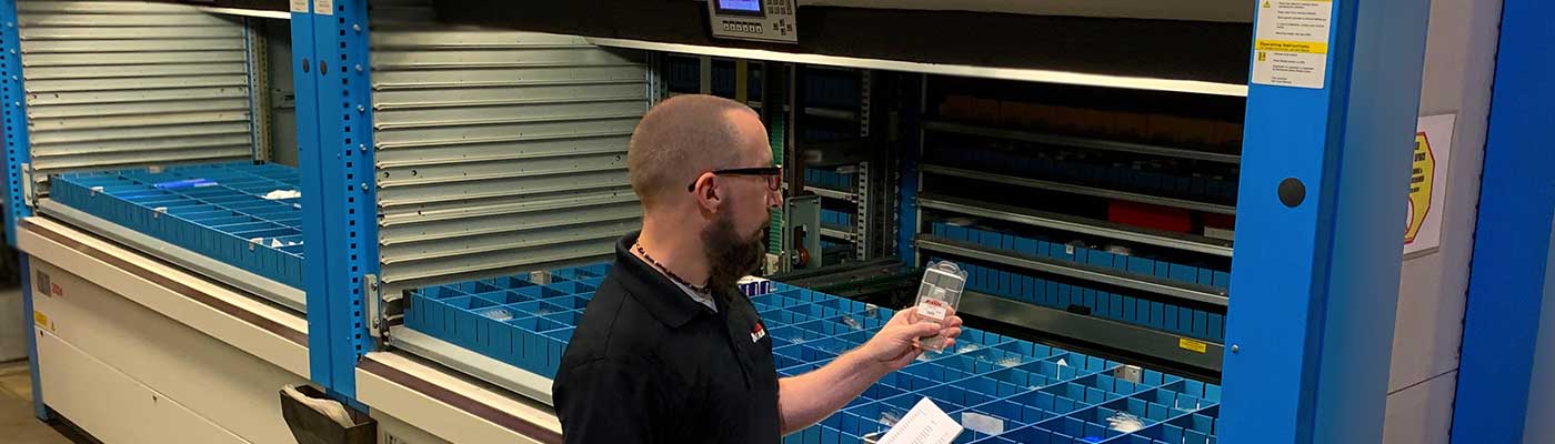 man organizing repair parts
